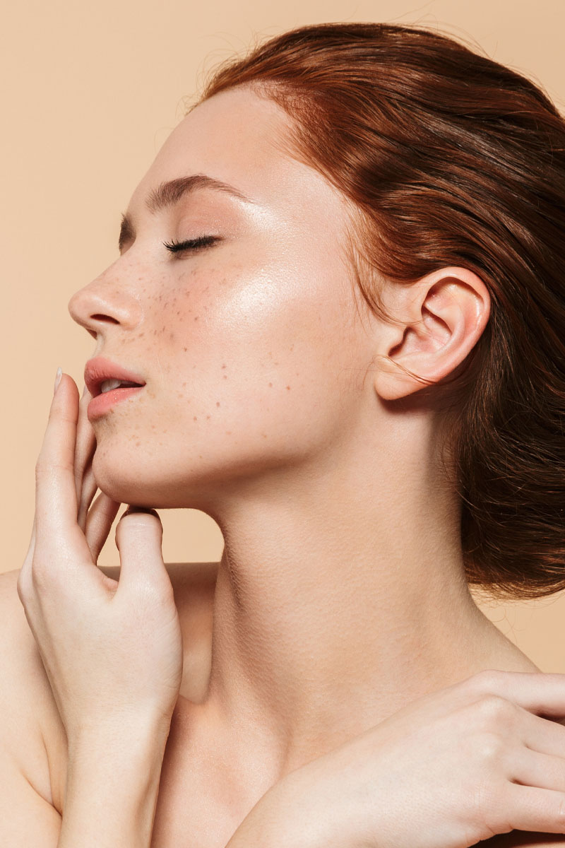 Amazing young redhead woman posing