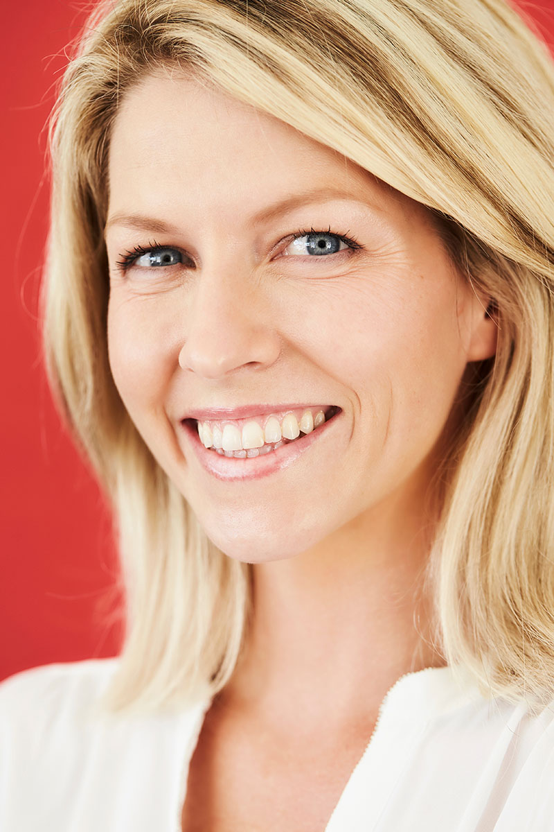 Happy and beautiful woman smiling to camera