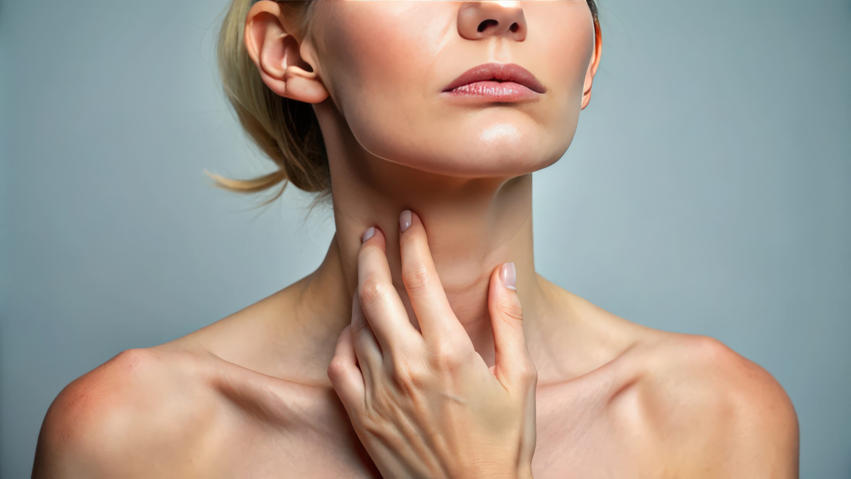 Close up view of caucasian woman holding loose skin on neck